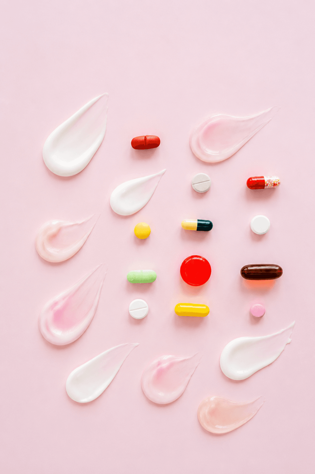 Oral medications and topical creams shown together for a comparison of dermatology treatments